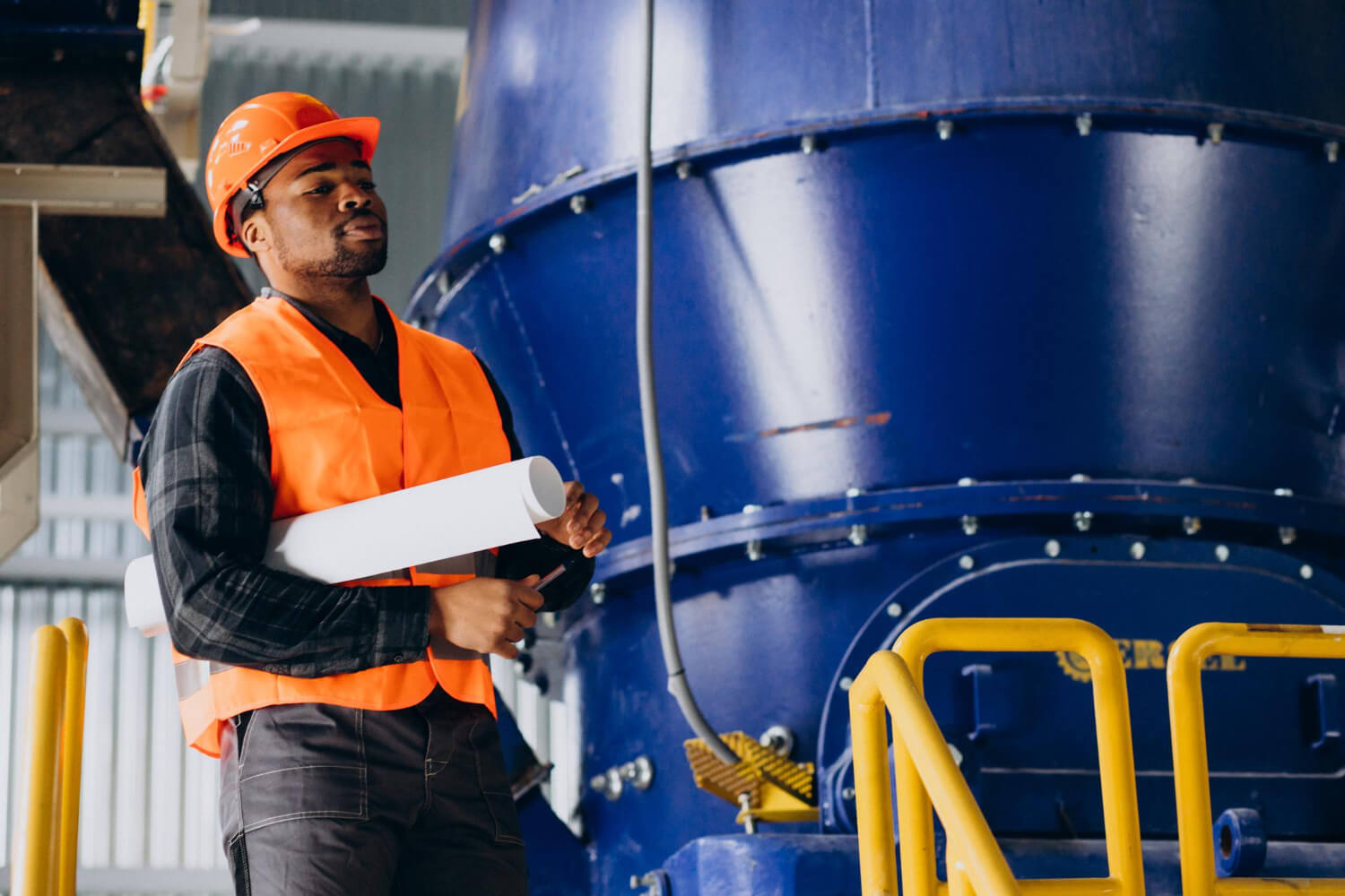 Industrial safety professional inspecting plant infrastructure